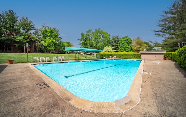 community pool featuring fence