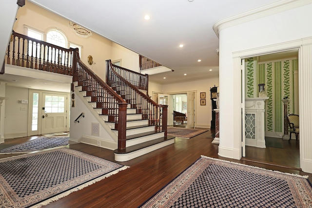 27 Country Club Rd, Ridgefield, CT 06877 - entryway with wood-type flooring, stairway, healthy amount of natural light, baseboards, and ornamental molding