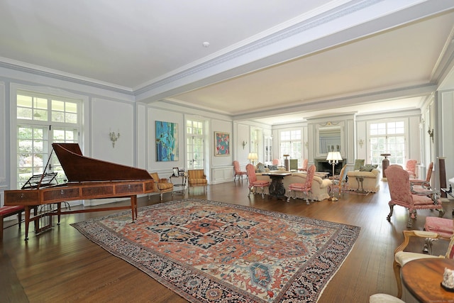 27 Country Club Rd, Ridgefield, CT 06877 - living area with crown molding, a decorative wall, plenty of natural light, and wood finished floors