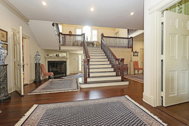 27 Country Club Rd, Ridgefield, CT 06877 - stairs with wood finished floors, a glass covered fireplace, recessed lighting, baseboards, and ornamental molding