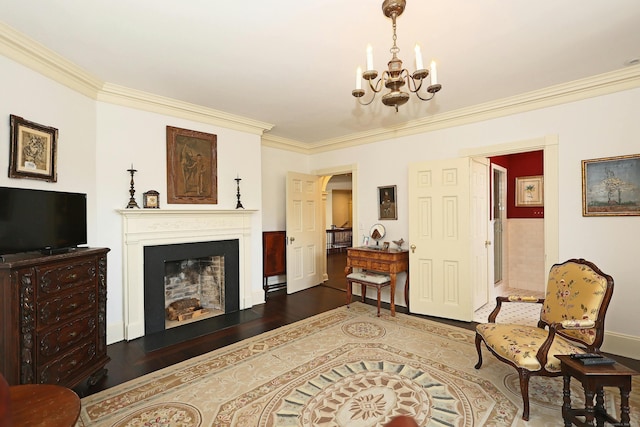 27 Country Club Rd, Ridgefield, CT 06877 - living room featuring a chandelier, ornamental molding, a fireplace, wood finished floors, and baseboards