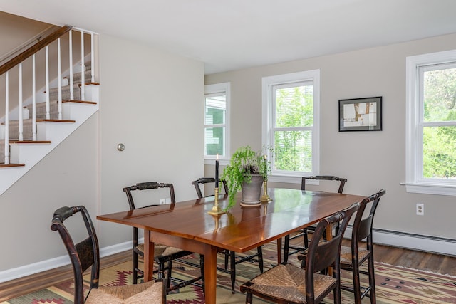 87 Canaan Rd Apt 2F, Salisbury, CT 06068 - dining space with wood finished floors, stairway, and a baseboard heating unit