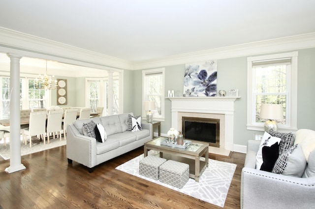 56 Grouse Ln, Woodbridge, CT 06525 - living area with a chandelier, crown molding, healthy amount of natural light, and dark wood finished floors