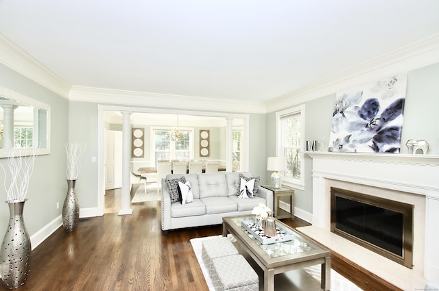 56 Grouse Ln, Woodbridge, CT 06525 - living area with decorative columns, ornamental molding, dark wood-style floors, a chandelier, and baseboards