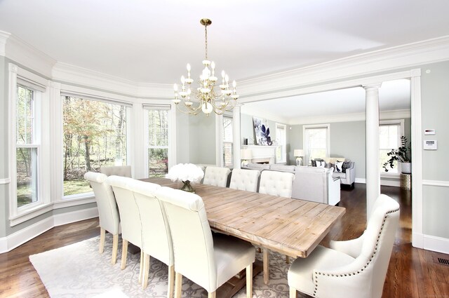 56 Grouse Ln, Woodbridge, CT 06525 - dining room featuring plenty of natural light, ornamental molding, a chandelier, dark wood-style floors, and baseboards