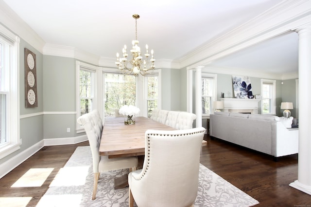 56 Grouse Ln, Woodbridge, CT 06525 - dining space with plenty of natural light, a chandelier, dark wood-type flooring, decorative columns, and ornamental molding