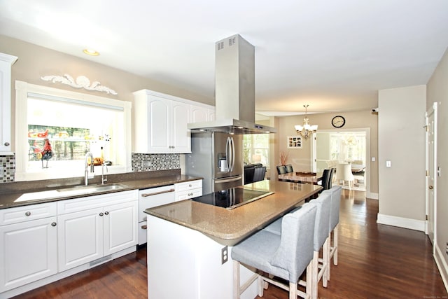 56 Grouse Ln, Woodbridge, CT 06525 - kitchen featuring island exhaust hood, stainless steel refrigerator with ice dispenser, black electric stovetop, and tasteful backsplash