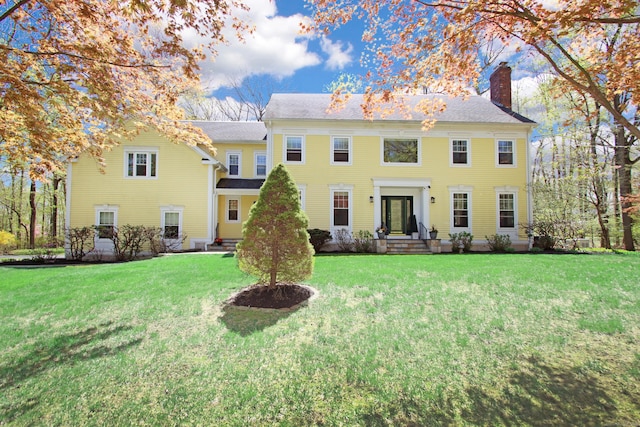 56 Grouse Ln, Woodbridge, CT 06525 - colonial home with a chimney and a front lawn
