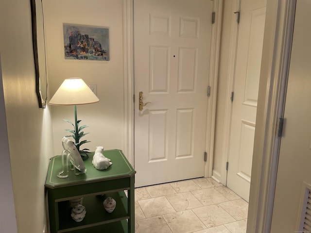 entryway with light marble finish flooring