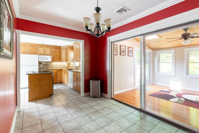 153 Mountain Rd, Cheshire, CT 06410 - kitchen featuring white appliances, light tile patterned floors, a sink, decorative backsplash, and a chandelier