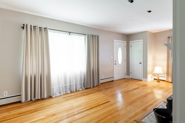 153 Mountain Rd, Cheshire, CT 06410 - entrance foyer featuring wood finished floors, a baseboard heating unit, and baseboards