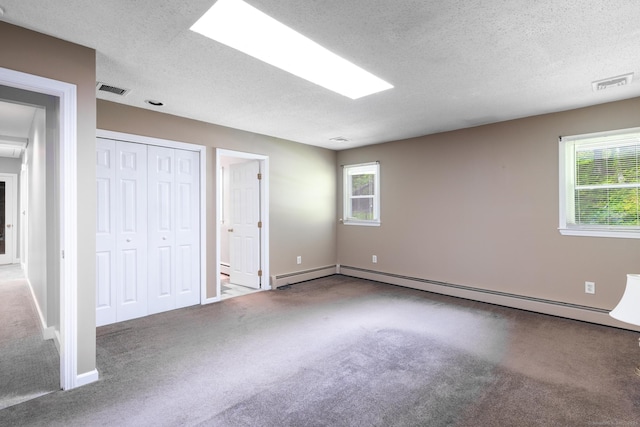 153 Mountain Rd, Cheshire, CT 06410 - unfurnished bedroom featuring a textured ceiling, carpet flooring, baseboards, baseboard heating, and a closet