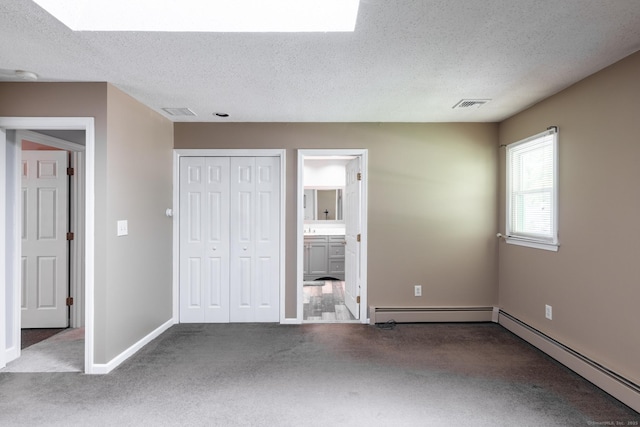 153 Mountain Rd, Cheshire, CT 06410 - unfurnished bedroom with carpet, a baseboard heating unit, a textured ceiling, baseboards, and a closet