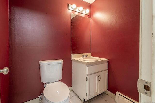 half bathroom featuring a baseboard heating unit, tile patterned floors, toilet, and vanity