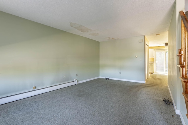 carpeted empty room featuring a baseboard radiator, baseboards, and a textured ceiling