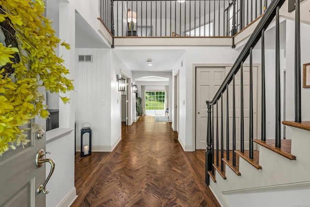 12 Rob Rider Rd, Redding, CT 06896 - foyer featuring baseboards, stairs, a towering ceiling, and arched walkways