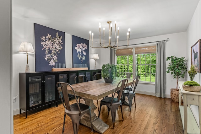 12 Rob Rider Rd, Redding, CT 06896 - dining space featuring a chandelier, wood finished floors, and baseboards