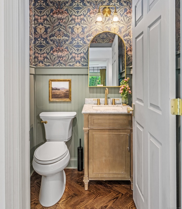 12 Rob Rider Rd, Redding, CT 06896 - bathroom featuring wallpapered walls, a wainscoted wall, vanity, and toilet