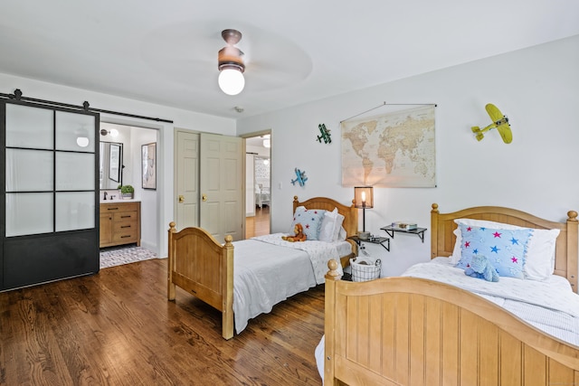 12 Rob Rider Rd, Redding, CT 06896 - bedroom featuring wood finished floors, a barn door, ensuite bath, and ceiling fan