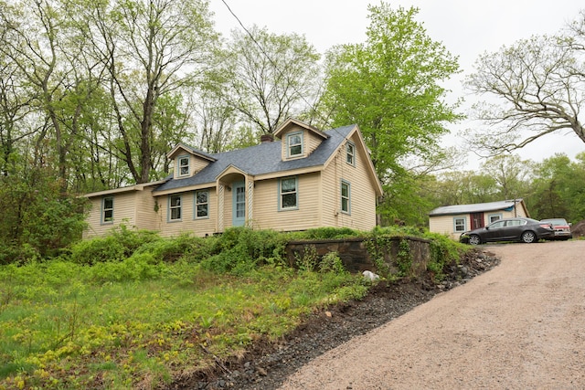 872 Nut Plains Rd, Guilford, CT 06437 - cape cod-style house featuring dirt driveway and a shingled roof