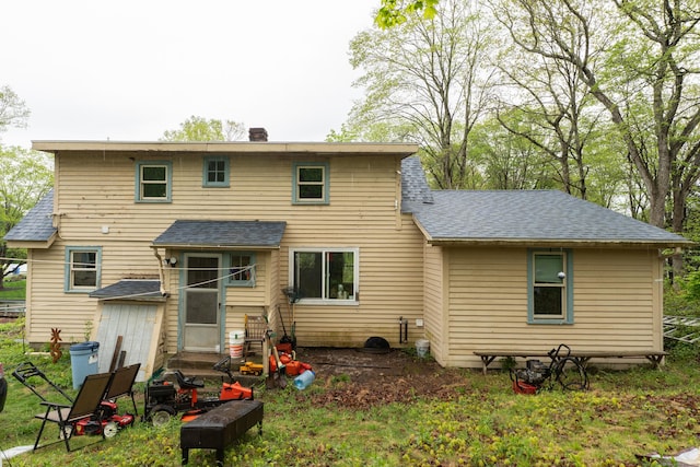 872 Nut Plains Rd, Guilford, CT 06437 - rear view of house with a chimney and a shingled roof