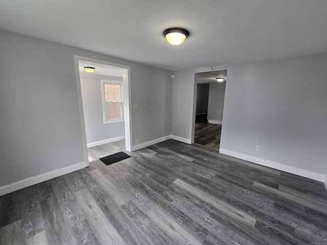 78 Tremont St, New Britain, CT 06051 - spare room with dark wood-style flooring and baseboards