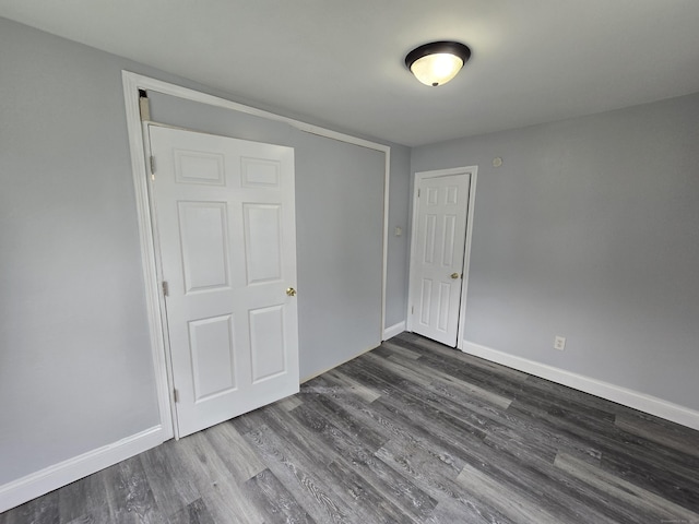 78 Tremont St, New Britain, CT 06051 - unfurnished bedroom featuring dark wood-style floors and baseboards