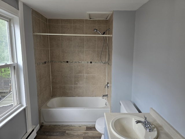 78 Tremont St, New Britain, CT 06051 - full bathroom featuring toilet, a sink, wood finished floors, tub / shower combination, and a baseboard heating unit
