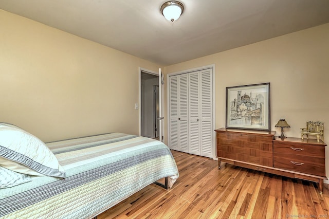 bedroom with a closet and light wood-style floors