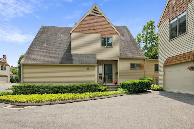 8 Cottonwood Ct Unit 8, Granby, CT 06035 - view of front of property with asphalt driveway, a shingled roof, and an attached garage