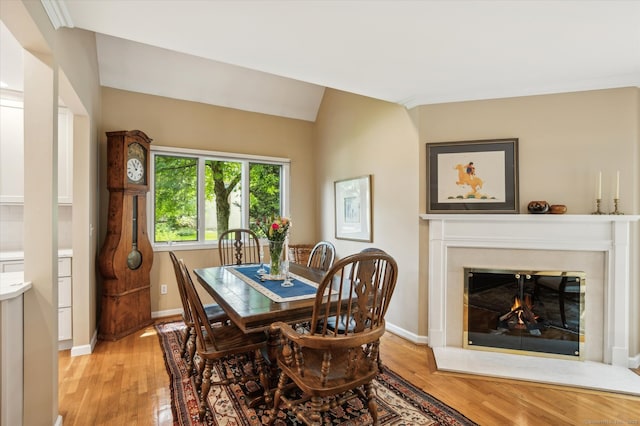 8 Cottonwood Ct Unit 8, Granby, CT 06035 - dining space featuring light wood-style floors, baseboards, and a fireplace with flush hearth