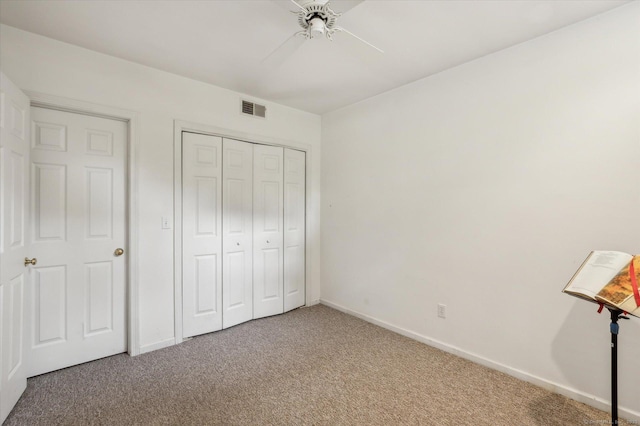 8 Cottonwood Ct Unit 8, Granby, CT 06035 - unfurnished bedroom featuring carpet floors, baseboards, a closet, and a ceiling fan