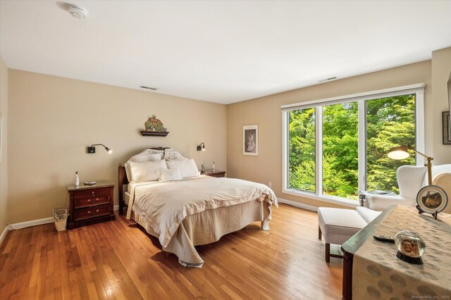 8 Cottonwood Ct Unit 8, Granby, CT 06035 - bedroom with light wood-style floors and baseboards
