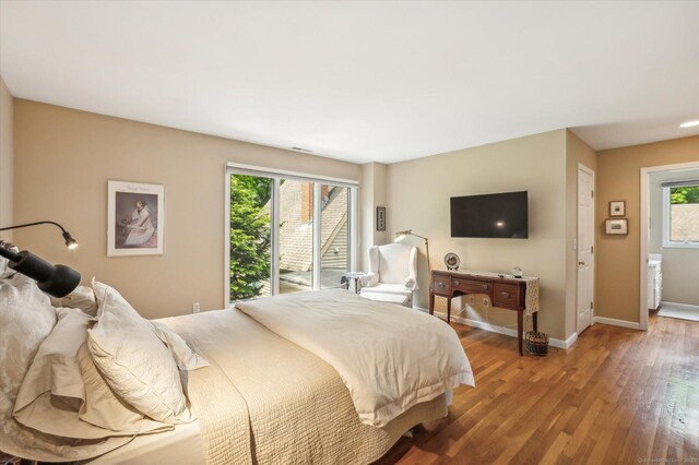 8 Cottonwood Ct Unit 8, Granby, CT 06035 - bedroom with light wood-style floors, baseboards, and access to exterior