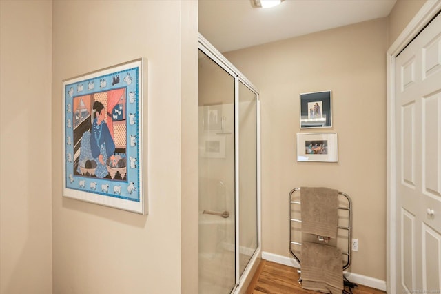 8 Cottonwood Ct Unit 8, Granby, CT 06035 - bathroom with a shower stall, wood finished floors, and baseboards