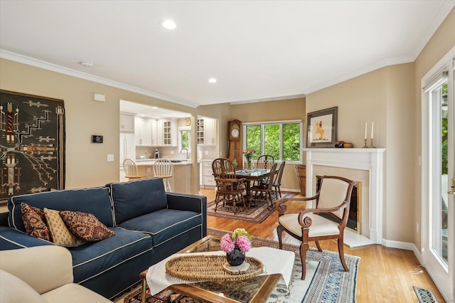8 Cottonwood Ct Unit 8, Granby, CT 06035 - living room featuring light wood-type flooring, ornamental molding, recessed lighting, and baseboards