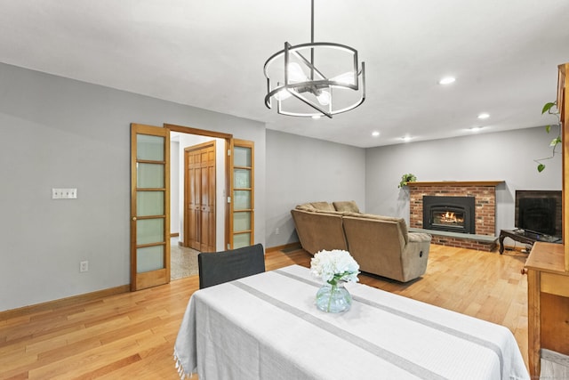 74R Green Ln, Durham, CT 06422 - dining space featuring light wood-style floors, a fireplace, recessed lighting, a chandelier, and baseboards