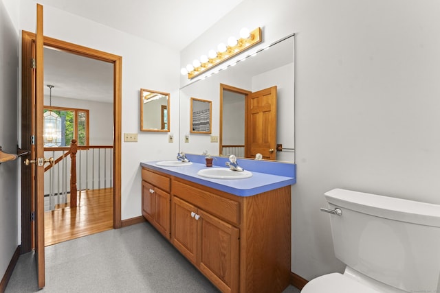 74R Green Ln, Durham, CT 06422 - bathroom with double vanity, baseboards, and toilet