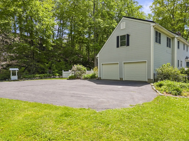 74R Green Ln, Durham, CT 06422 - view of home's exterior featuring a garage and driveway