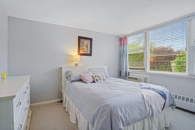 15 Ellsworth St Apt 22, Bridgeport, CT 06605 - bedroom featuring radiator heating unit, light colored carpet, baseboards, and a wall mounted AC