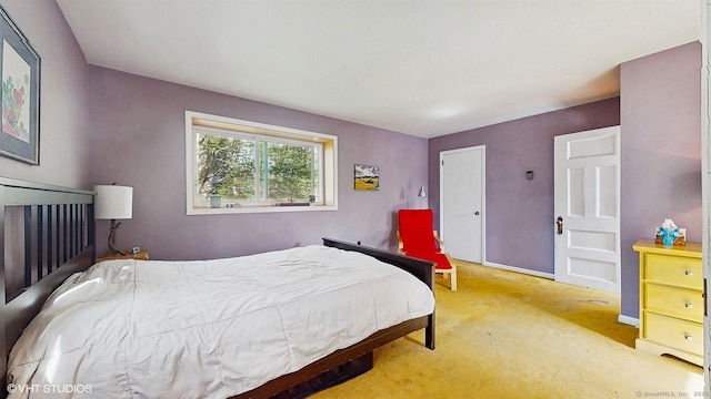 bedroom with carpet and baseboards