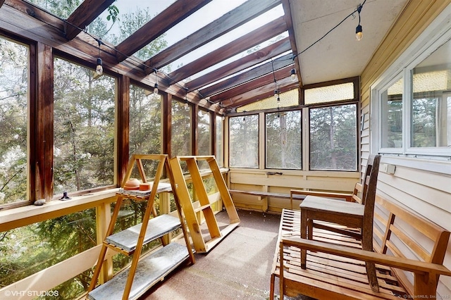 sunroom / solarium featuring vaulted ceiling
