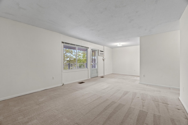 281 Gardner Ave Unit G5, New London, CT 06320 - unfurnished room with carpet floors, baseboards, a textured ceiling, and a wall mounted AC