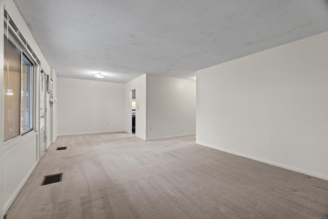 281 Gardner Ave Unit G5, New London, CT 06320 - unfurnished room with light carpet, a textured ceiling, and baseboards