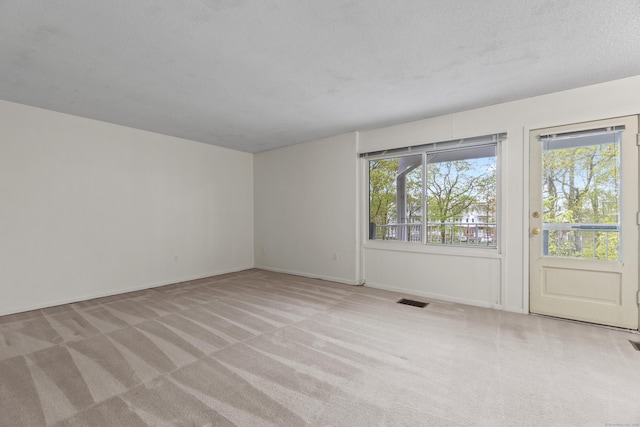 281 Gardner Ave Unit G5, New London, CT 06320 - spare room with carpet flooring, baseboards, and a textured ceiling