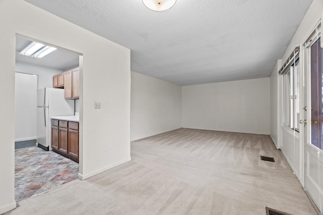 281 Gardner Ave Unit G5, New London, CT 06320 - spare room featuring light carpet, a textured ceiling, and baseboards