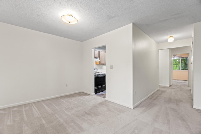 281 Gardner Ave Unit G5, New London, CT 06320 - empty room with light carpet, a textured ceiling, and baseboards
