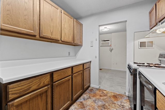 281 Gardner Ave Unit G5, New London, CT 06320 - kitchen featuring range with electric stovetop, a wall mounted air conditioner, light countertops, and dark colored carpet