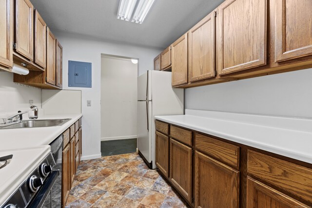 281 Gardner Ave Unit G5, New London, CT 06320 - kitchen with a sink, electric panel, freestanding refrigerator, range, and light countertops