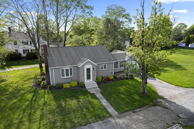 42A New London Rd, Groton, CT 06355 - view of front facade with a front yard, a chimney, and a shingled roof
